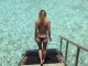 Cili yll po lahet topless në këtë foto?