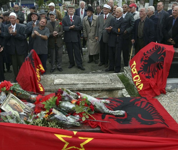 Albanian communists pay their respects at the tomb of the late communist dictator Enver Hoxha at a public cemetery in Tirana October 16, 2009. Hundreds of communist supporters on Thursday commemorated the 101th birthday of Hoxha, who ruled Albania with an iron fist for half a century.    REUTERS/Arben Celi (ALBANIA ANNIVERSARY POLITICS)